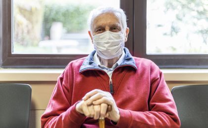 elderly man in a hospital with respirator
