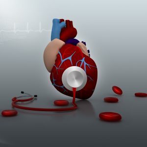 Stethoscope on a heart in medical background